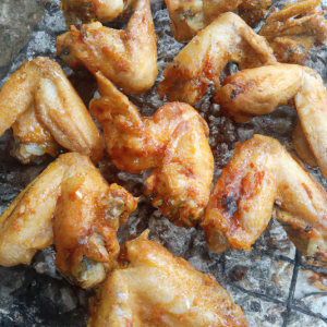 Charcoal-Grilled Chicken Wings displaying a perfect char and glaze, ready to be savored.