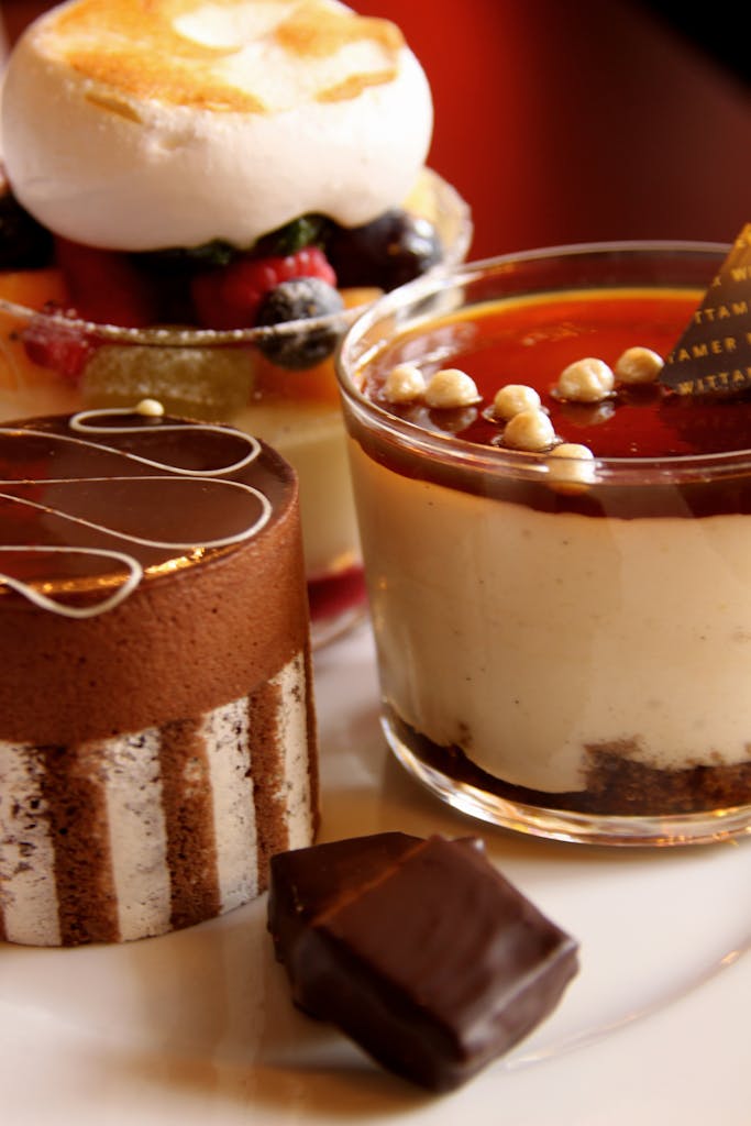 A delectable selection of gourmet desserts including chocolate mousse and creamy puddings.