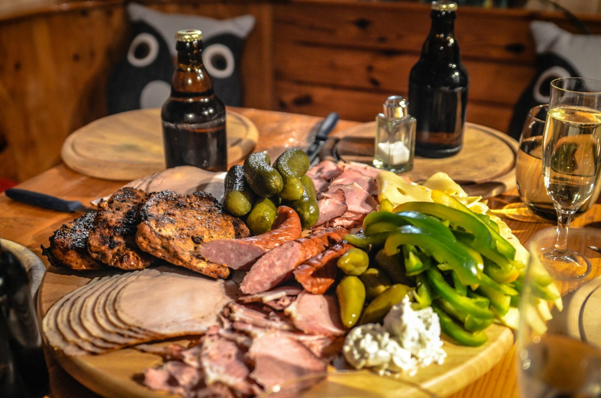 A delightful spread of meats, cheeses, and pickles paired with beer, perfect for Oktoberfest celebrations.