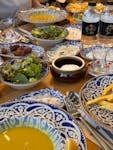 A vibrant display of traditional Turkish dishes set on a blue patterned tableware.