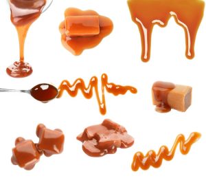 Caramel candies and caramel sauce on a white background