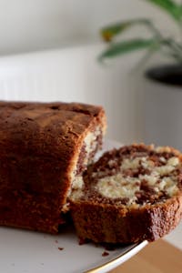 Close-up of a sliced homemade marble cake on a plate, perfect for breakfast or dessert.