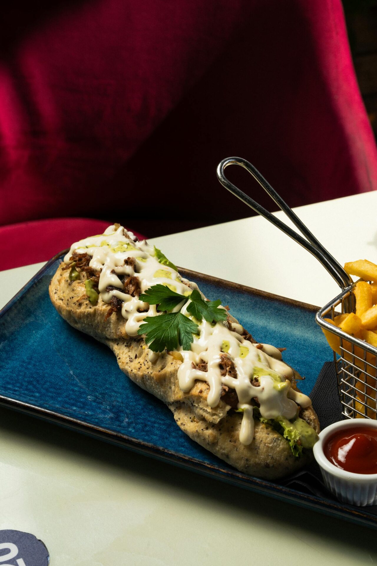 Delicious gourmet sandwich with melted cheese and fries, perfect for a hearty meal.