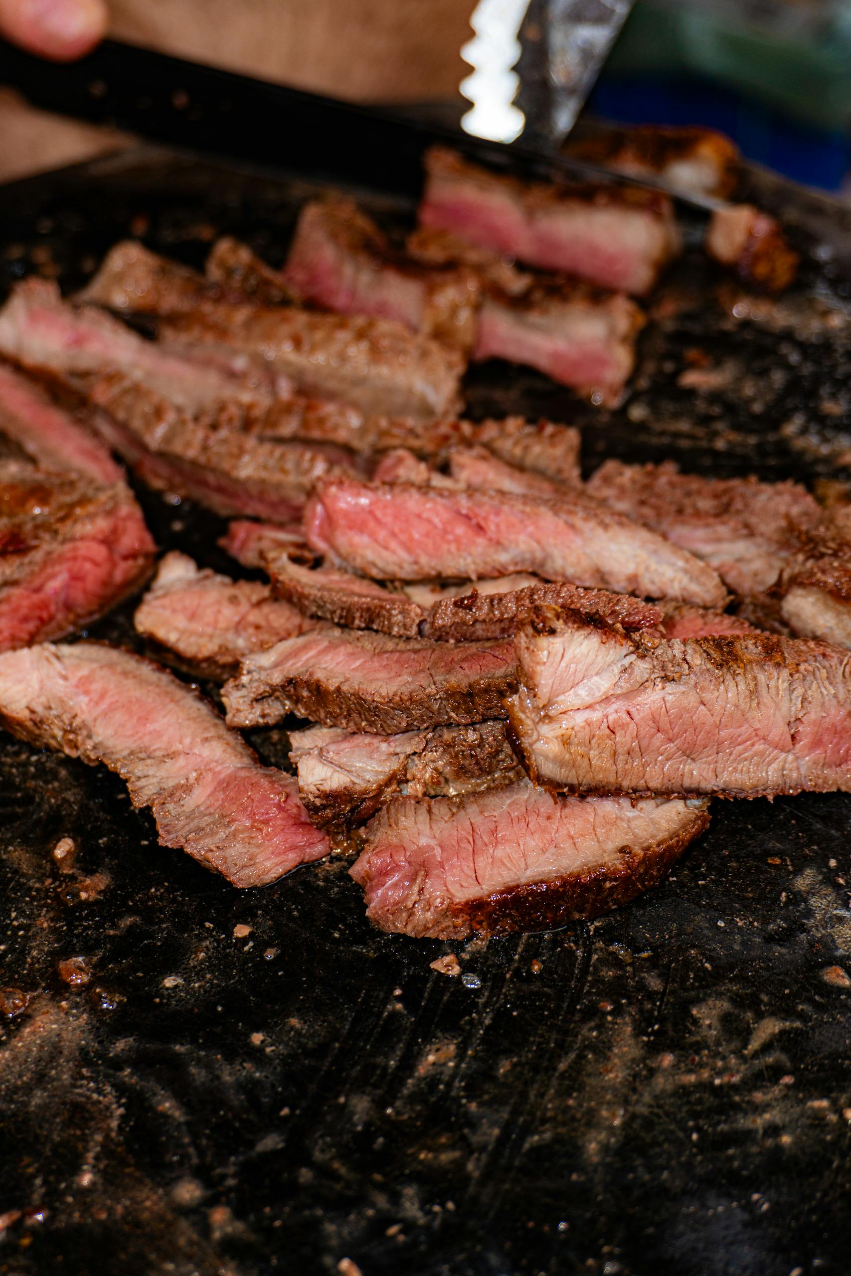 Juicy grilled steak slices on a rustic grill, capturing authentic Brazilian BBQ vibes.
