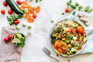 Quinoa bowl with roasted vegetables and garnishes
