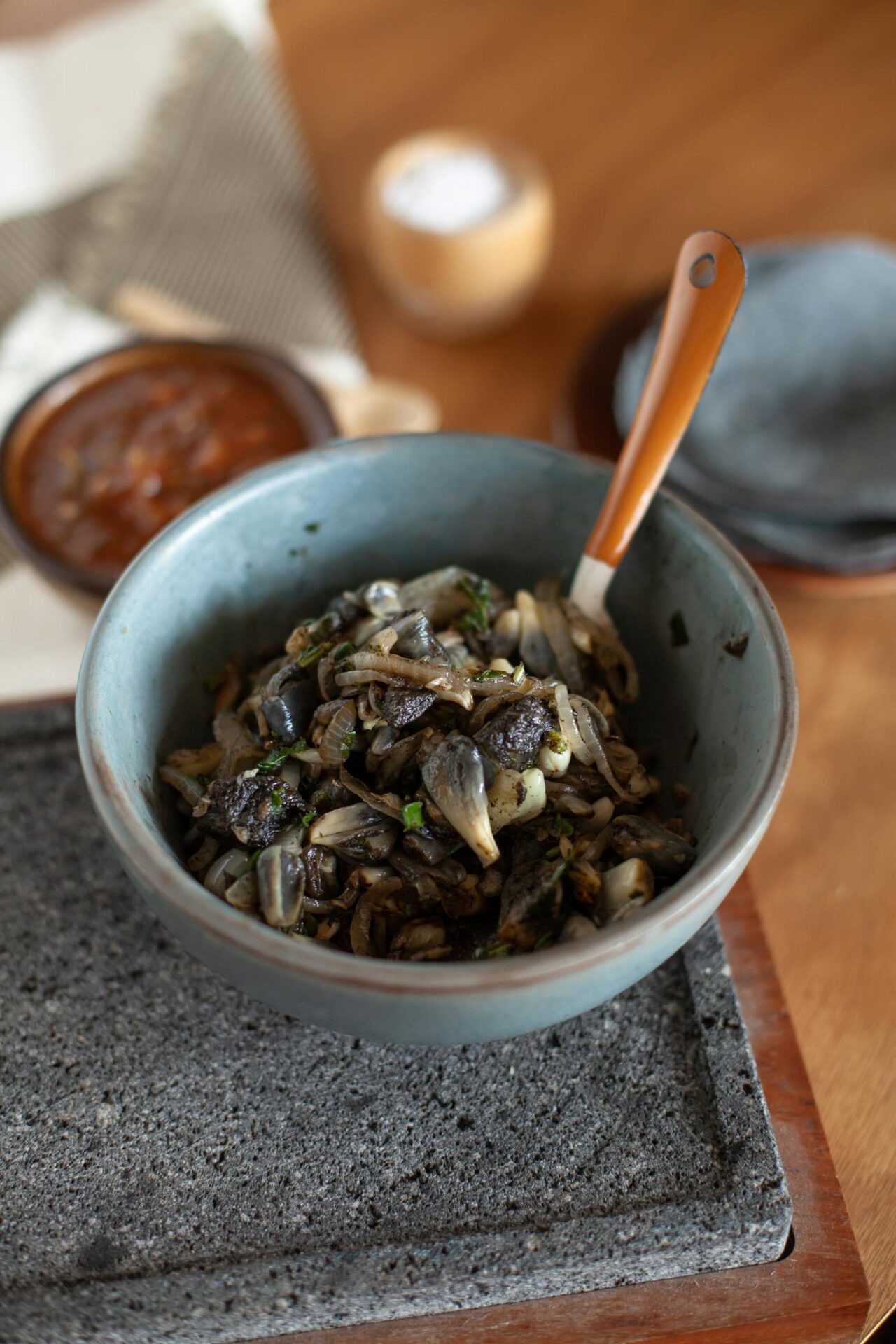 Tantalizing huitlacoche dish served in a blue bowl, capturing the essence of Mexican cuisine.