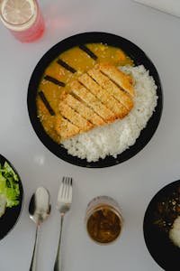 Top view of a Japanese katsu curry dish served with rice in Madiun, Indonesia.